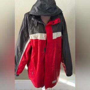 Vintage red waterproof cagoule jacket with zip away hood and reflective piping